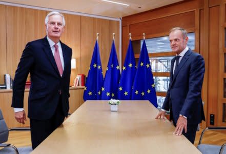 The European Union's Brexit negotiator, Michel Barnier is welcomed by European Council President Donald Tusk prior to a meeting in Brussels, Belgium, October 16, 2018.  Olivier Hoslet/Pool via Reuters