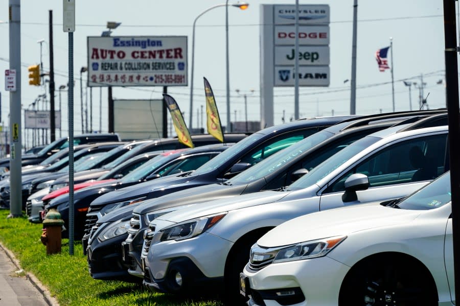 <em>Used cars for sale are parked roadside at an auto lot in Philadelphia on Tuesday, July 12, 2022.</em> (AP Photo/Matt Rourke)