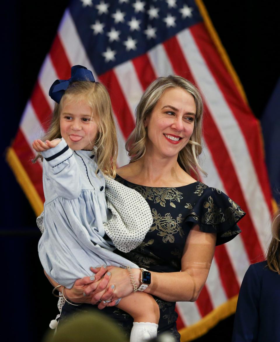 Chris McGarvey and daughter Greta, 4, share the stage with husband and dad Morgan McGarvey during his acceptance speech for the 3rd Congressional District seat at the Democratic watch party on election night at the Galt House in Louisville, Ky. on Nov. 8, 2022.