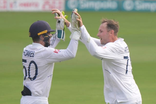 Tom Hartley, right, took two wickets gland Cricket