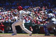 Apr 20, 2019; St. Louis, MO, USA; St. Louis Cardinals catcher Yadier Molina (4) hits a sacrifice RBI against the New York Mets during the third inning at Busch Stadium. Mandatory Credit: Jeff Curry-USA TODAY Sports