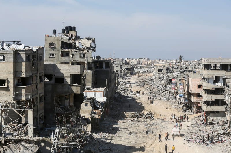 Palestinians inspect destroyed residential buildings after the Israeli military withdrew most of its ground troops from the southern Gaza Strip amid the ongoing conflict with Palestinian fighters in Khan Younis on Sunday. Photo by Ismael Mohamad/UPI