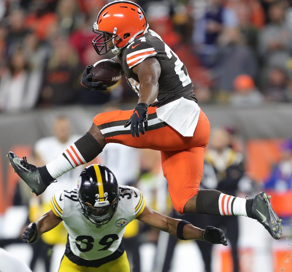 Browns running back Nick Chubb hurdles Steelers safety Minkah Fitzpatrick as he picks up a first down during the first half Thursday, Sept. 22, 2022, in Cleveland.