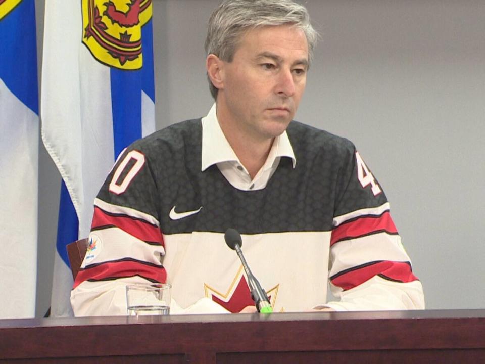 Nova Scotia Premier Tim Houston, wearing a Team Canada sweater on the day of the world junior hockey tournament's gold medal game Thursday, is calling on the prime minister to meet with the premiers to discuss health-care funding. (CBC - image credit)