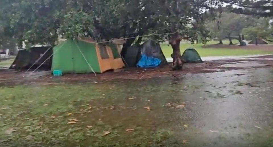People living in tents in Musgrave Park, Brisbane during heavy rain. 