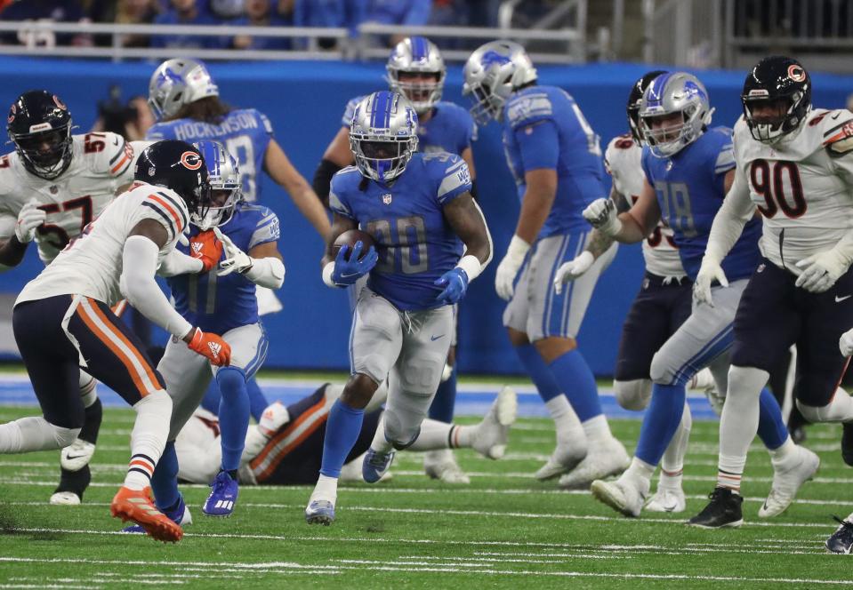 Detroit Lions running back Jamaal Williams runs for a first down against the Chicago Bears during the second half Thursday, Nov. 25, 2021, at Ford Field.