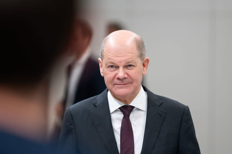 Germany's Chancellor Olaf Scholz reacts during his visit to the vacuum technology company J. Schmalz. Silas Stein/dpa