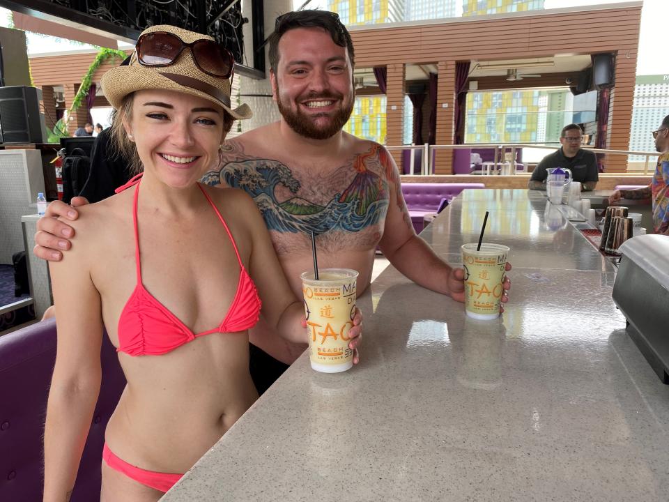 Laura Hill, of Melbourne, Australia, and Keegan Bradley of Austin, Texas, at the pool at Marquee Dayclub in Las Vegas during a pool party tour.