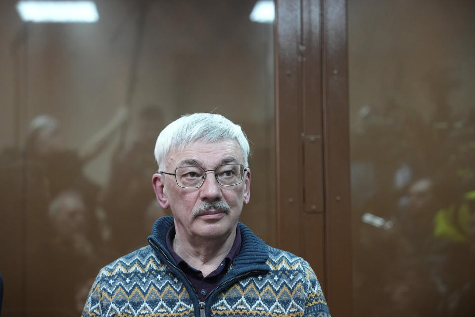 The co-chair of Nobel Peace Prize winning Memorial Human Rights Centre Oleg Orlov sits in a courtroom prior to a court session for a new trial on charges of repeated discrediting Russian military, in Moscow, Russia, on Tuesday, Feb. 27, 2024. (AP Photo/Alexander Zemlianichenko)