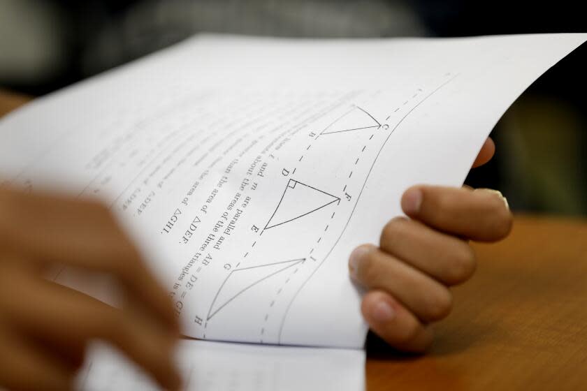 LOS ANGELES, CALIFORNIA--AUG. 29, 2019--At Roybal Learning Center in Los Angeles, Robert Montgomery teaches a "transition to college math and statistics" class to 12th graders.The course, developed in partnership with the CSU, includes review of essential math skills. (Carolyn Cole/Los Angeles Times)