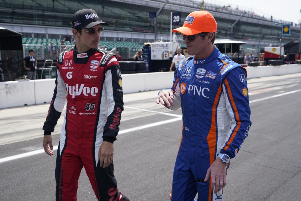 Christian Lundgaard, left, of Denmark, talks with Scott Dixon, of New Zealand, before practice for the Indianapolis 500 auto race at Indianapolis Motor Speedway, Monday, May 22, 2023, in Indianapolis. (AP Photo/Darron Cummings)