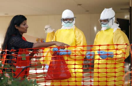 Centers for Disease Control and Prevention (CDC) instructor Rupa Narra (L) gives guidance to health care workers in preparation for the response to the current Ebola outbreak, during a CDC safety training course in Anniston, Alabama, October 6, 2014. REUTERS/Tami Chappell