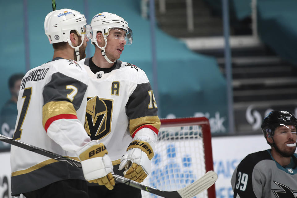 Vegas Golden Knights defenseman Alex Pietrangelo (7) celebrates with right wing Reilly Smith (19), who scored a goal against the San Jose Sharks during the first period of an NHL hockey game in San Jose, Calif., Friday, March 5, 2021. (AP Photo/Josie Lepe)