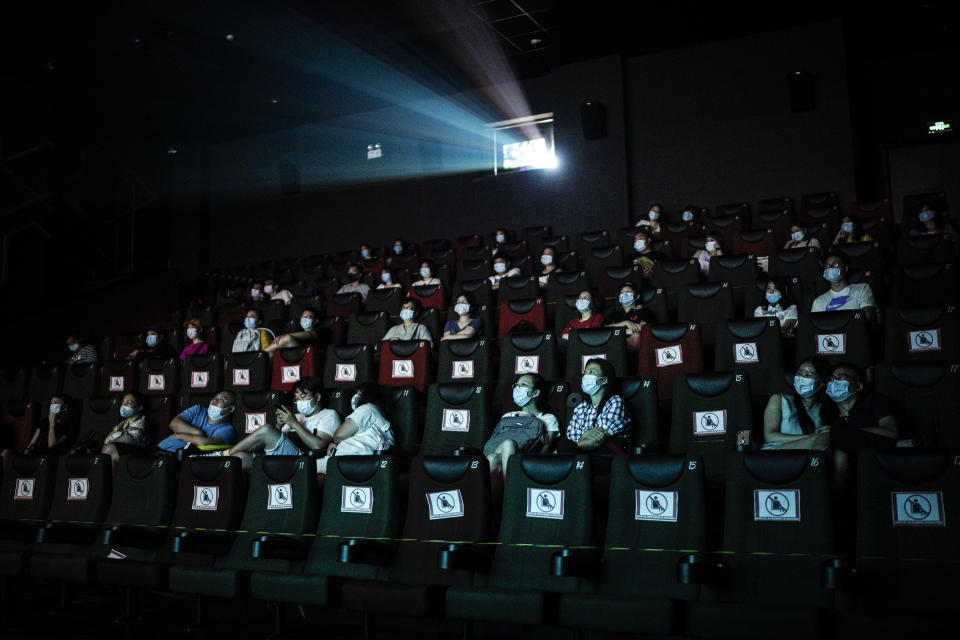 WUHAN, CHINA - JULY 20: (CHINA OUT)Residents watch a movie in a cinema in Wuhan on July 20, 2020 in Wuhan ,Hubei Province,China.Taking various measures against COVID-19, cinemas in the city reopened in an orderly manner on Monday. The China Film Administration, in a circular last week, allowed cinemas in low-risk areas to resume operation with effective epidemic prevention measures in place. (Photo by Getty Images)