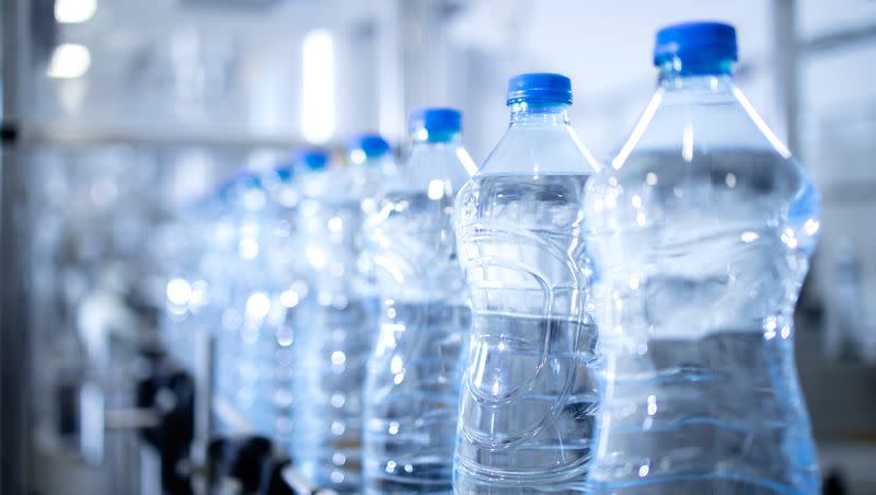 Plastic bottle move on a conveyor belt in a factory. You might be ingesting 22,043,000 to 22,146,000 small plastic particles a year in total.