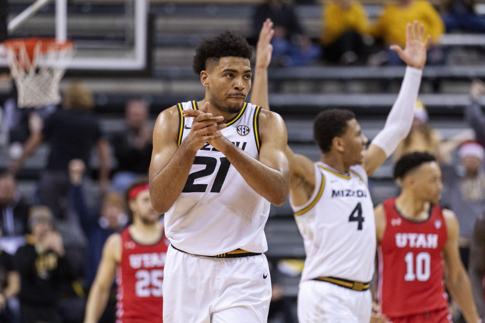 Missouri's Ronnie DeGray III celebrates with teammates during the final minute of the second half of an NCAA college basketball game against Utah Saturday, Dec. 18, 2021, in Columbia, Mo. (AP Photo/L.G. Patterson)