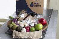 FILE - This Oct. 6, 2014, file photo shows an example of a home-delivered meal from Blue Apron. The growing options for outsourcing meal planning, grocery shopping and cooking can be called time-saving blessings or culture-destroying curses. In the end, they're probably a complicated mix of both. (AP Photo/Matthew Mead, File)