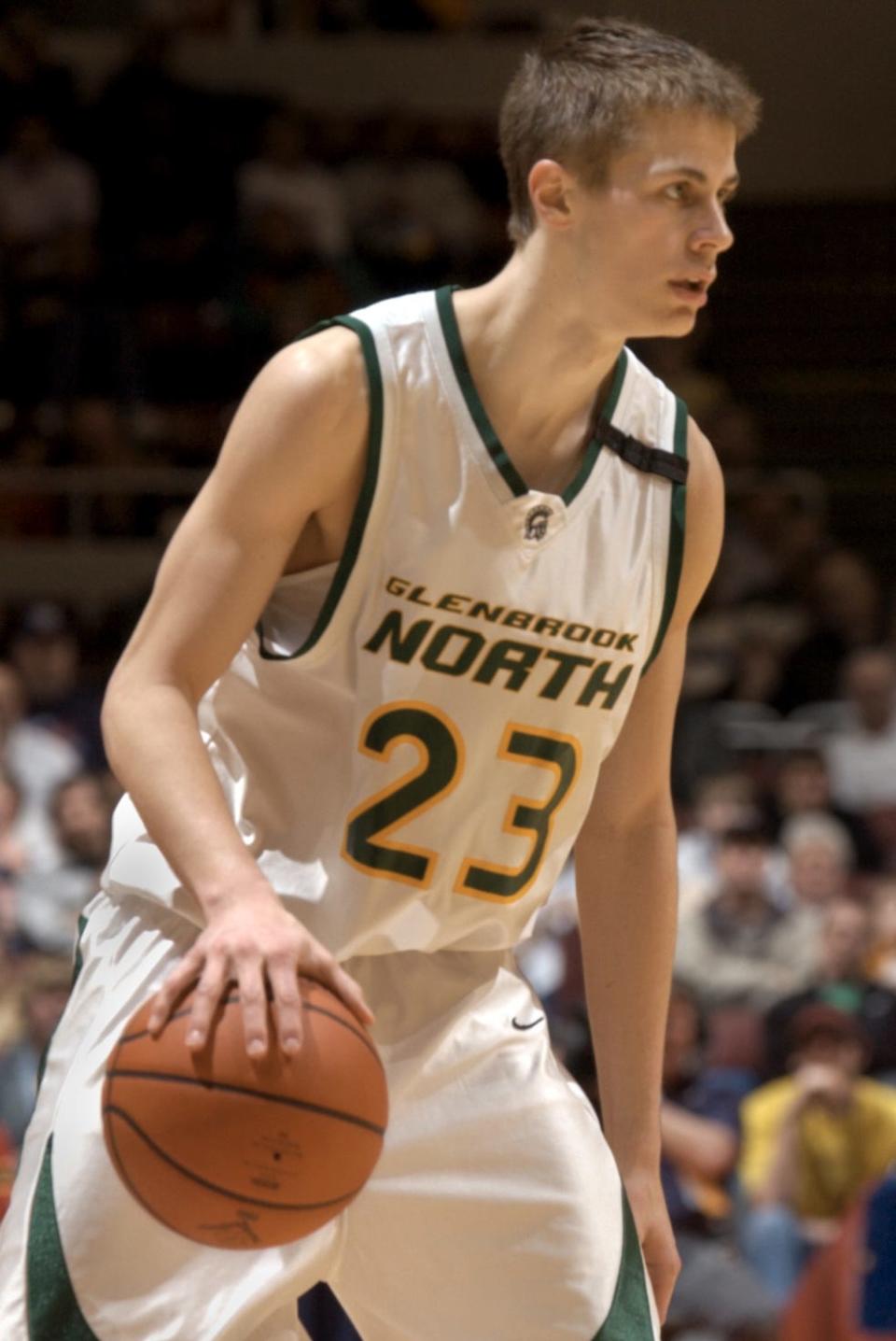 In this March 22, 2005, photo, Northbrook Glenbrook junior guard Jon Scheyer brings the ball down the court during their semifinal game Saturday against Rockford Jefferson at Carver Arena in Peoria.