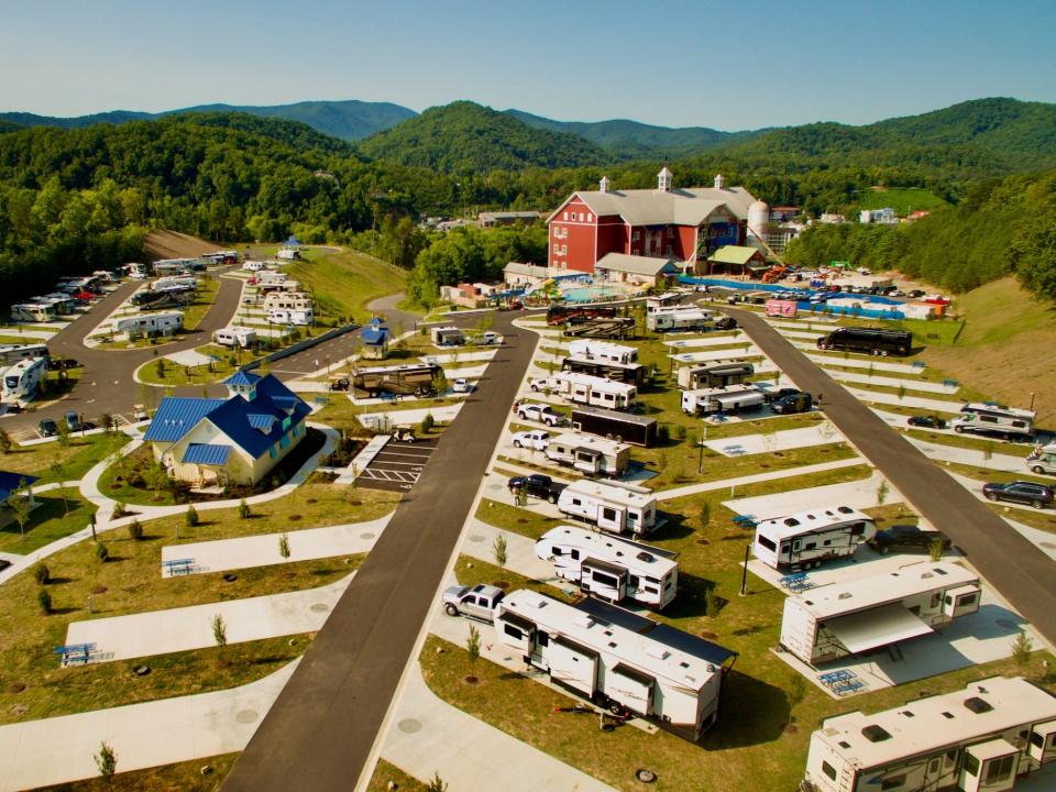 RVs parked at a Camp Magaritaville among mountains.