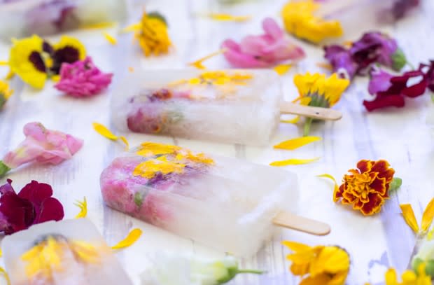 <p><b><b><b>We can’t get over how pretty these frozen beauts are. Bursting with bubbly and edible flowers, they’ll definitely impress any guests you have coming over for a BBQ this summer. Recipe <a rel="nofollow noopener" href="http://jerryjamesstone.com/recipe/champagne-flowers-popsicles/" target="_blank" data-ylk="slk:here" class="link ">here</a>. </b></b></b></p>