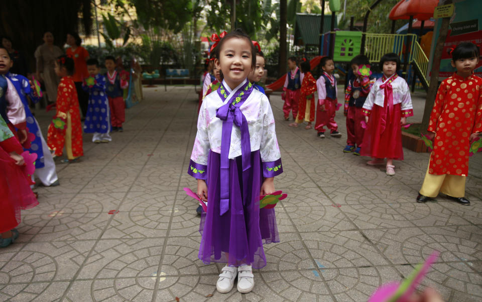 In this Thursday, Feb. 21, 2019, photo, children in Vietnamese and Korean traditional costumes get ready for a dance at Vietnam-Korea Friendship Kindergarten in Hanoi, Vietnam. The children have been practicing singing and dancing, hoping to show off their talents to North Korean leader Kim Jong Un when he comes to town this week for his second summit meeting with U.S. President Donald Trump. (AP Photo/Hau Dinh)