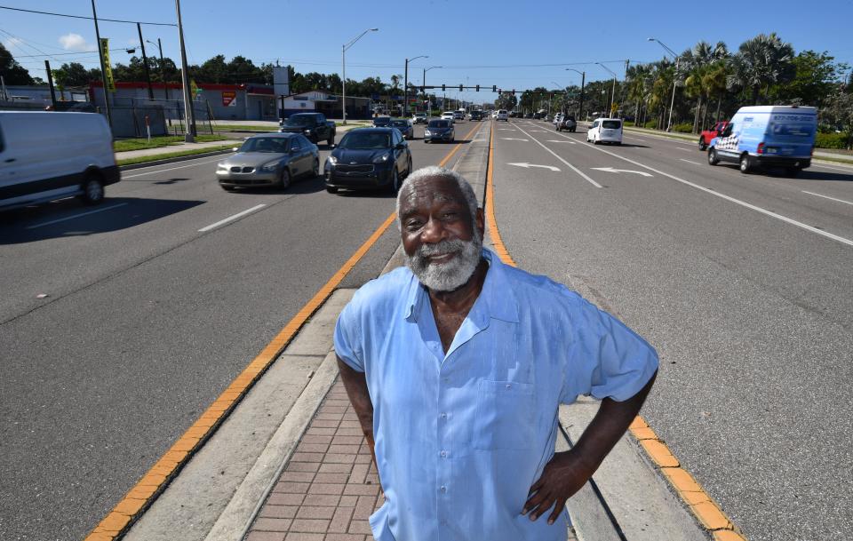 Fredd Atkins, former mayor of the City of Sarasota, Florida, stands on the media of U.S. 301 on Wednesday, Aug. 11, 2021.  Atkins recalls a time when his community wasn't divided by a six-lane highway. 