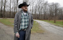 <p>Shane Johnson poses outside his home in Tippecanoe, Ind., Jan. 12, 2017. Johnson was born into extremism. His father and many of his father’s relatives were part of the Klan, he said, so there was only one real way for him to go as a youth. “We were known as the Klan family,” he said. “I got my first Klan robe when I was 14.” He decided to quit after getting arrested, stopping drinking and meeting the woman who is now his wife. (Photo: Michael Conroy/AP) </p>