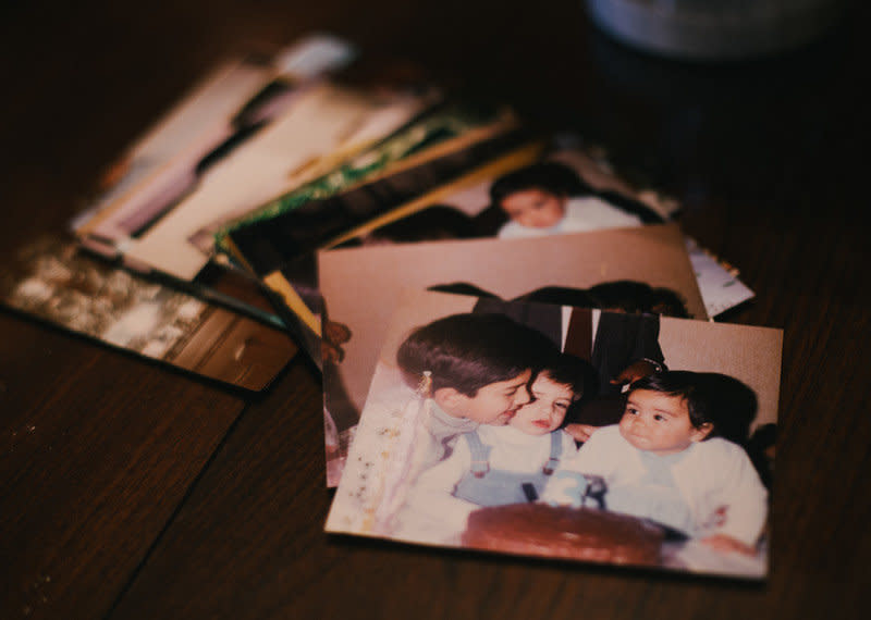 Photos of Enrique Guerrero's childhood are displayed in his mother's home. She reminisces over them as she waits for his release from jail.