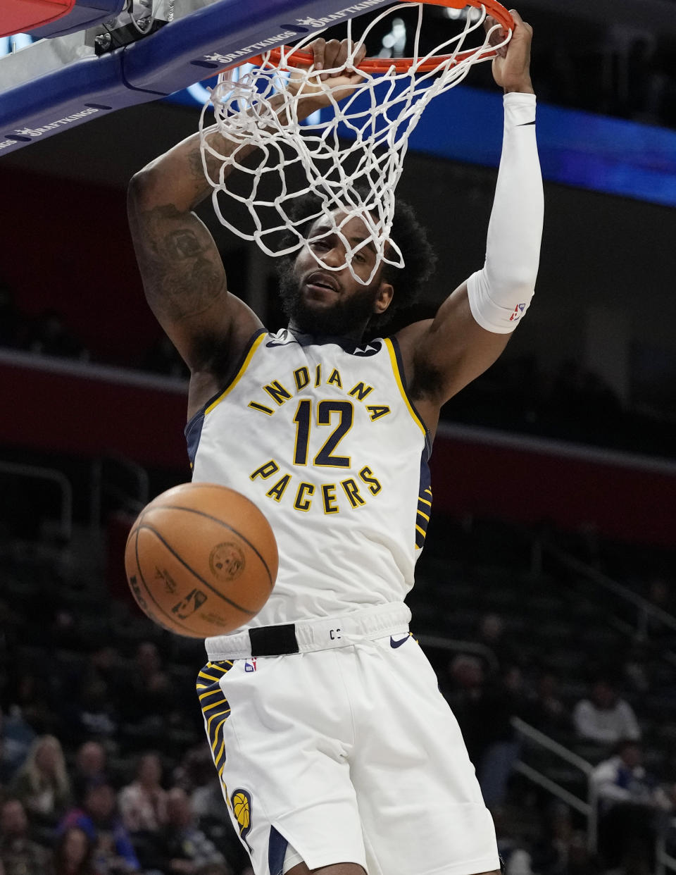 Indiana Pacers forward Oshae Brissett dunks during the second half of an NBA basketball game against the Detroit Pistons, Monday, March 13, 2023, in Detroit. (AP Photo/Carlos Osorio)