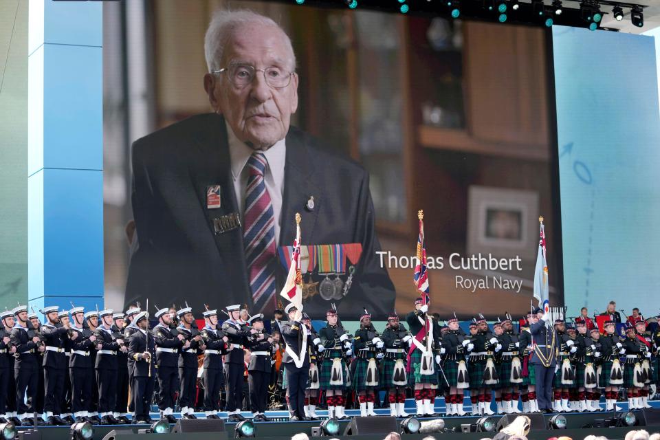 Veteran Cuthbert Cuthbert is seen on a huge TV screen during the D-Day national commemoration event in Portsmouth, England, Wednesday, June 5, 2024.(AP Photo/Kin Cheung, Pool)