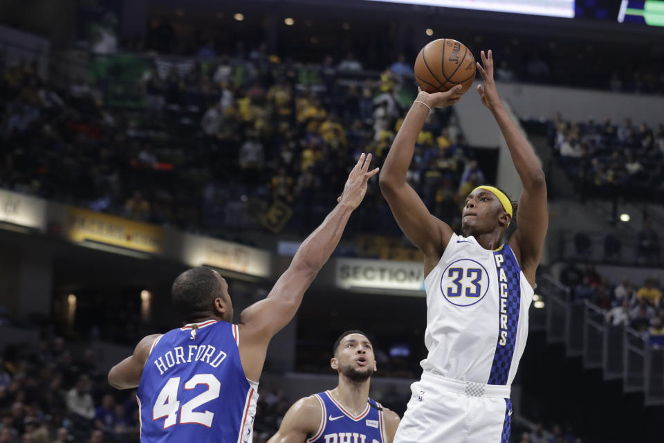 Indiana Pacers' Myles Turner (33) shoots over Philadelphia 76ers' Al Horford (42) during the first half of an NBA basketball game, Monday, Jan. 13, 2020, in Indianapolis. (AP Photo/Darron Cummings)