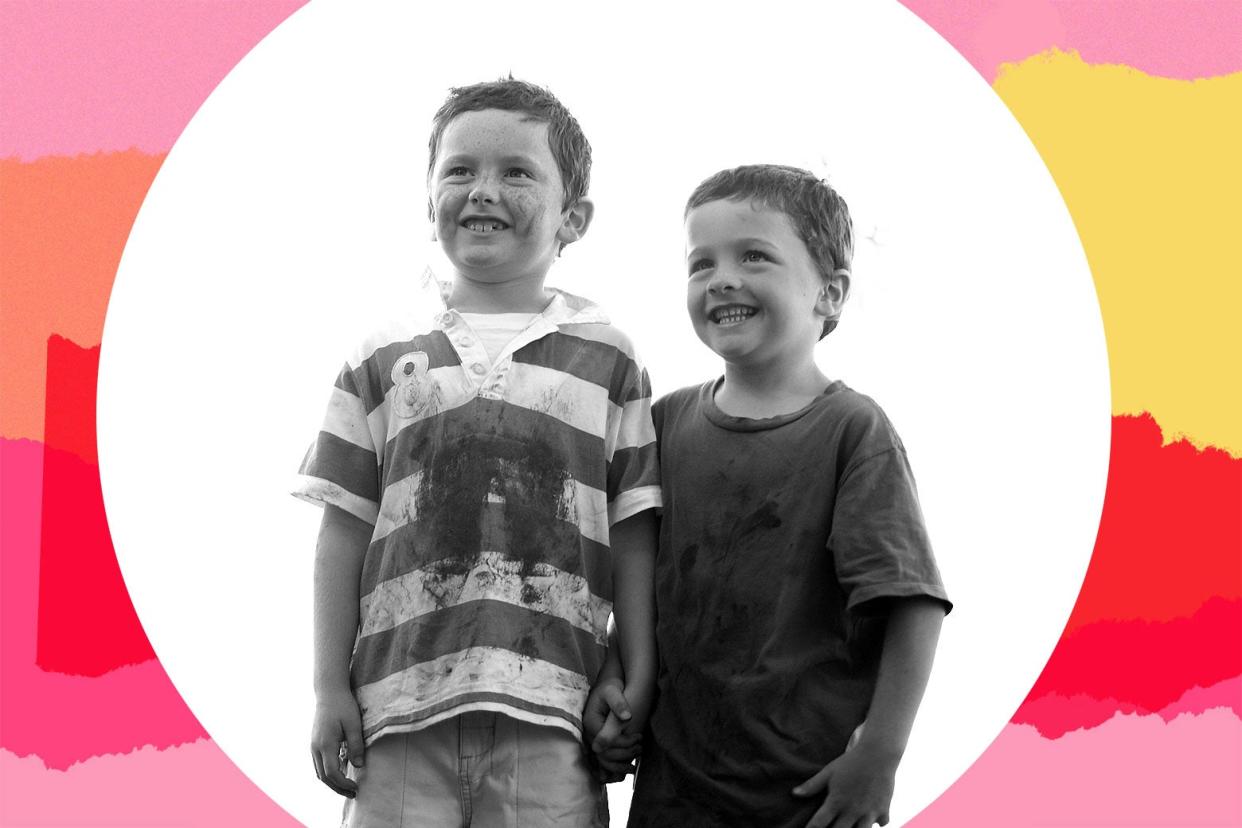 Two young boys with dirty clothing.