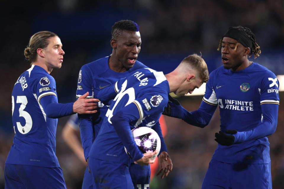 Nicolas Jackson and Noni Madueke attempt to claim the penalty from Cole Palmer (Getty)