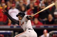 Joaquin Arias #13 of the San Francisco Giants hits the ball resulting in an error by third baseman Scott Rolen #27 of the Cincinnati Reds leading to the winning run as the Giants win 2-1 in the 10th inning in Game Three of the National League Division Series at the Great American Ball Park on October 9, 2012 in Cincinnati, Ohio. (Photo by Andy Lyons/Getty Images)