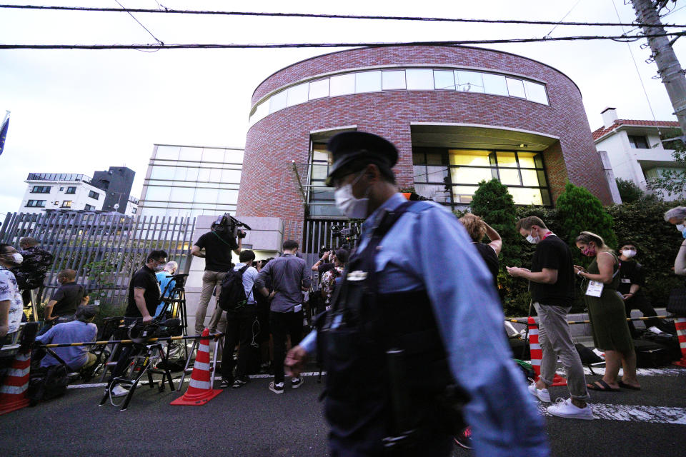 Media crews gather in front of the Embassy of Poland in Tokyo, Japan, after Belarusian Olympic athlete Krystsina Tsimanouskaya visited the embassy Monday, Aug. 2, 2021. The Olympic sprinter plans to seek asylum in Poland after alleging that officials tried to force her home, where she feared for her safety, an activist group said Monday. (AP Photo/Kantaro Komiya)