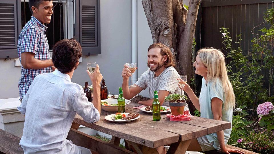 friends eating in backyard