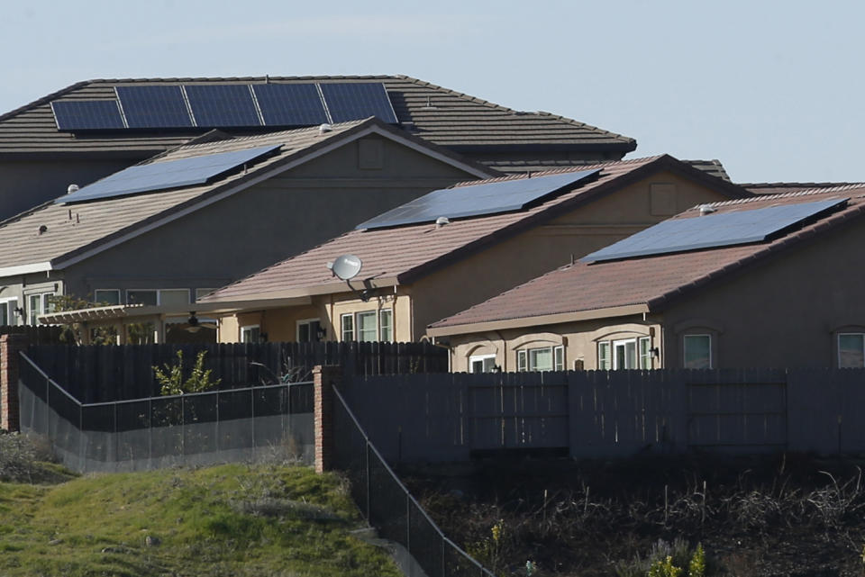 Solar panels on rooftops of a housing development