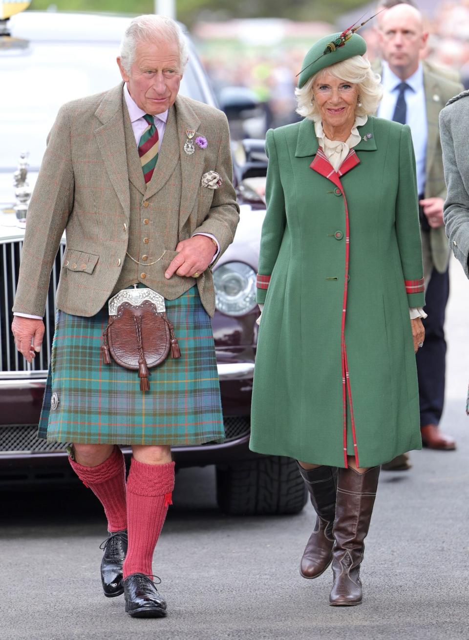 BRAEMAR, SCOTLAND - SEPTEMBER 03: Prince Charles, Prince of Wales, known as the Duke of Rothesay when in Scotland and Camilla, Duchess of Cornwall attend the Braemar Highland Gathering at the Princess Royal &amp; Duke of Fife Memorial Park on September 03, 2022 in Braemar, Scotland. The Braemar Gathering is the most famous of the Highland Games and is known worldwide. Each year thousands of visitors descend on this small Scottish village on the first Saturday in September to watch one of the more colourful Scottish traditions. The Gathering has a long history and in its modern form it stretches back nearly 200 years. The Queen Elizabeth Platinum Jubilee Archway was designed by architect Keith Ross, erected to celebrate 70 years of Her Majesty as monarch and as Patron of The Braemar Royal Highland Society, organiser of the annual Braemar Gathering. (Photo by Chris Jackson/Getty Images)