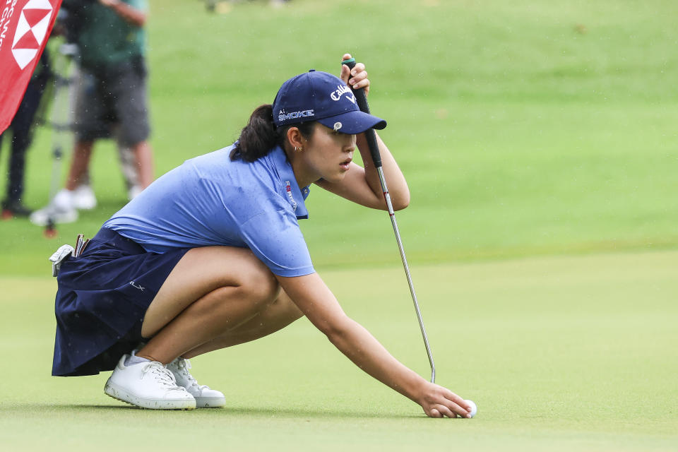 Andrea Lee of the U.S., lines up a putt on the third hole during the final round of the HSBC Women's Wold Championship at the Sentosa Golf Club in Singapore Sunday, March 3, 2024. (AP Photo/Danial Hakim)