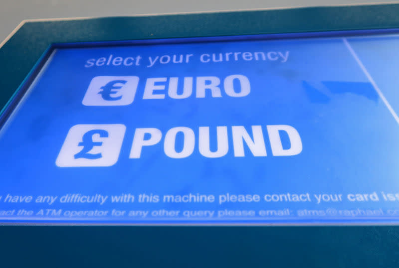 A cash machine ATM that offers withdrawals in either Pound Sterling or Euros is seen in Canary Wharf Financial centre in London, Britain, June 30, 2016. REUTERS/Russell Boyce