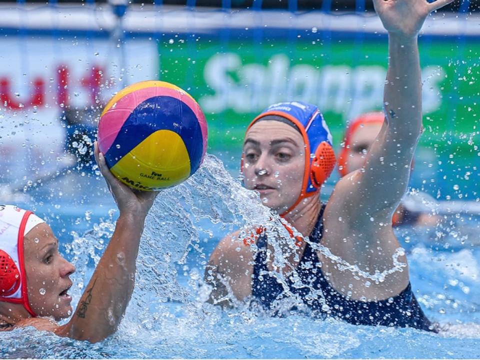 Shae la Roche, left, scored one of Canada's seven goals in an 11-7 loss to Sabrina van der Sloot and the Netherlands in Round of 16 play on Sunday at the world aquatics championships in Budapest, Hungary. (Szilard Koszticsak/MTI via The Associated Press - image credit)