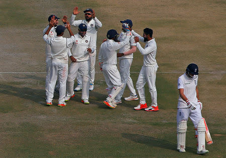 Cricket - India v England - Third Test cricket match - Punjab Cricket Association Stadium, Mohali, India - 29/11/16 - India's players celebrate the dismissal of England's Joe Root. REUTERS/Adnan Abidi