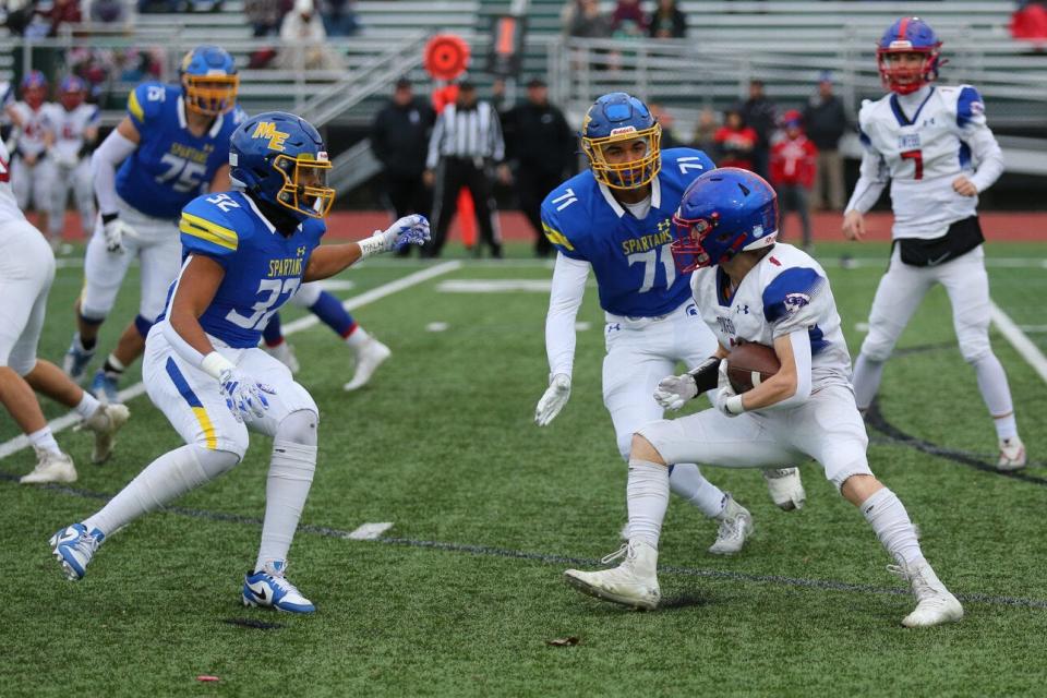 Maine-Endwell defenders close in for the tackle against Owego, Nov. 11, 2023.