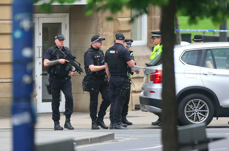 Armed police are patrolling the streets of Manchester (PA)