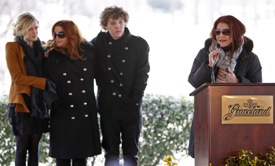 Priscilla Presley, right, speaks during a ceremony commemorating Elvis Presley's 75th birthday on Friday, Jan. 8, 2010 in Memphis, Tenn. Listening are  her daughter, Lisa Marie, second from left, and Lisa Marie's children Riley Keough, 21, left, and Benjamin Keough, 18, third from left. (AP Photo/Mark Humphrey)