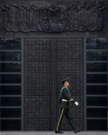 A paramilitary police officer patrols near Tiananmen Square on the first day of a plenary session of the 18th Central Committee of the Communist Party of China (CPC), in Beijing, China, October 24, 2016. REUTERS/Jason Lee