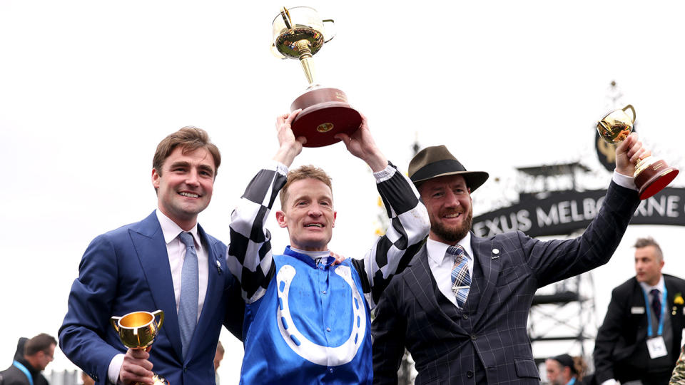 Co-trainers David Eustace and Ciaron Maher flank Melbourne Cup-winning jockey Mark Zahra, who rode Golden Trip to victory. (Photo by Jonathan DiMaggio/Getty Images for VRC)