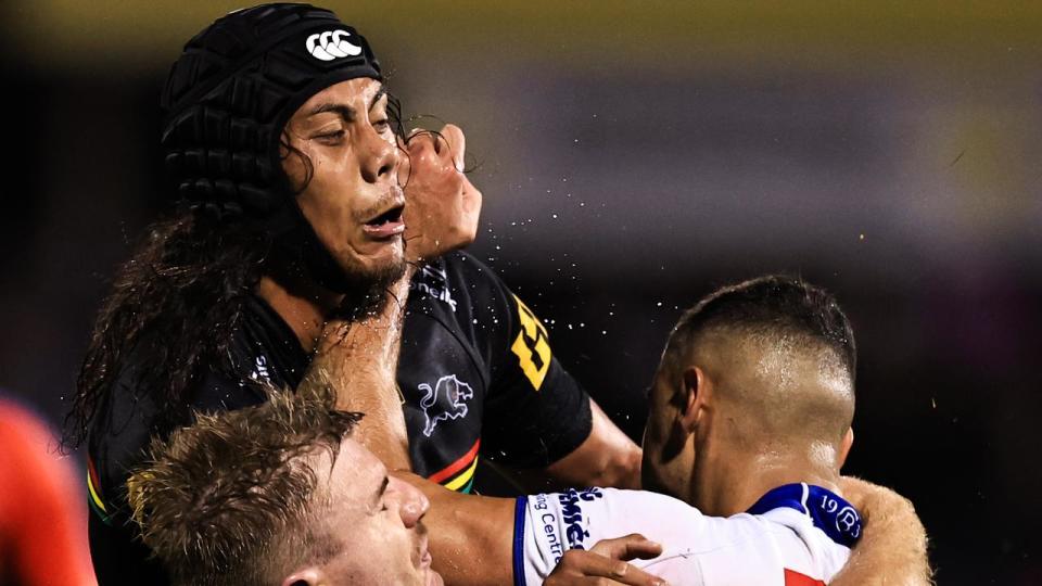 Jacob Kiraz of the Bulldogs is tackled by Jarome Luai of Penrith.