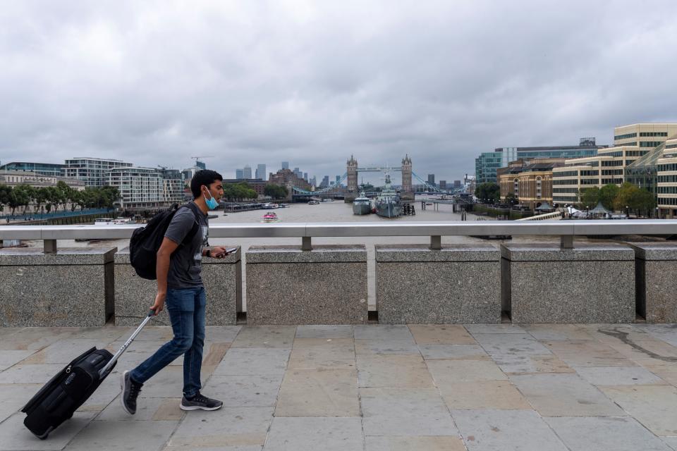 A man walks across London Bridge in London, Britain, Aug. 30, 2021. Another 26,476 people in Britain have tested positive for COVID-19, bringing the total number of coronavirus cases in the country to 6,757,650, according to official figures released Monday. (Photo by Ray Tang/Xinhua via Getty Images)