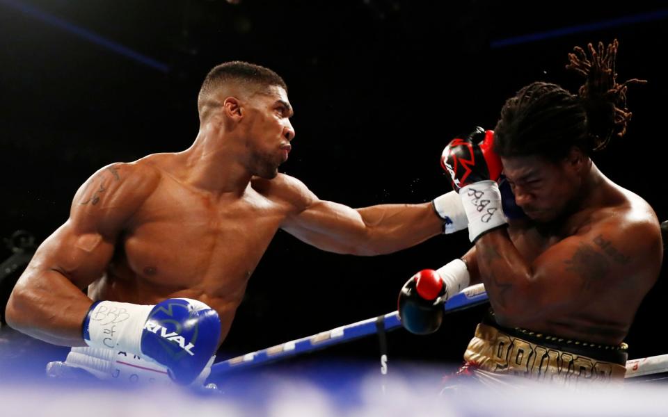 Charles Martin in action with Anthony Joshua Action  - Reuters